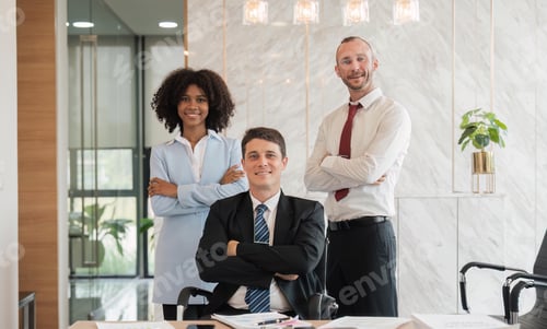 Preview: Portrait of successful business team looking at camera and smiling