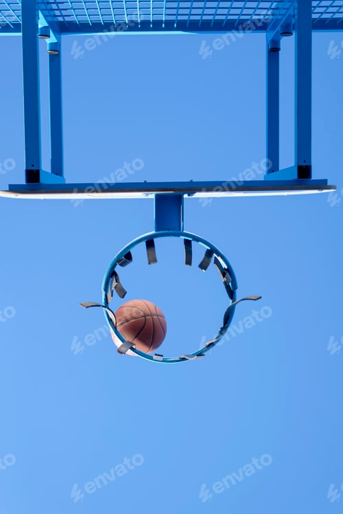 Preview: Basketball hit the net, the goal is achieved. Low angle view