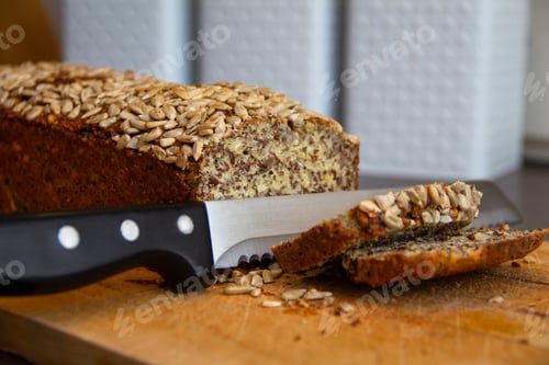 Preview: Close-up shot of a protein bread cutting with a knife