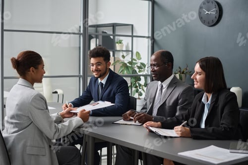 Preview: Woman having interview with specialists of visa center
