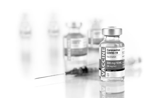 Preview: Coronavirus COVID-19 Vaccine Vials and Syringe On Reflective Surface