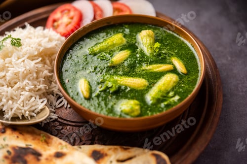 Preview: palak baby corn sabzi also known as spinach makai curry served with rice or roti, Indian food