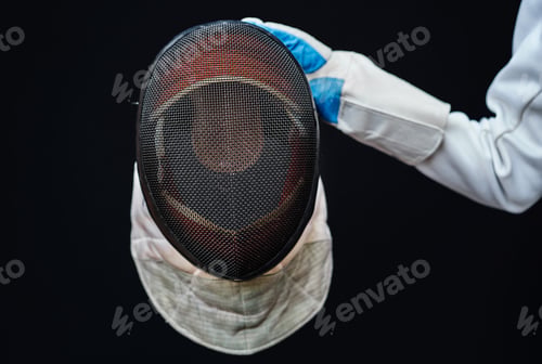 Preview: Close-up view of professional fencing protective equipment for foil have old fencing mask,