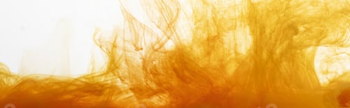 Vista previa: Close up view of orange watercolor paint swirls in water