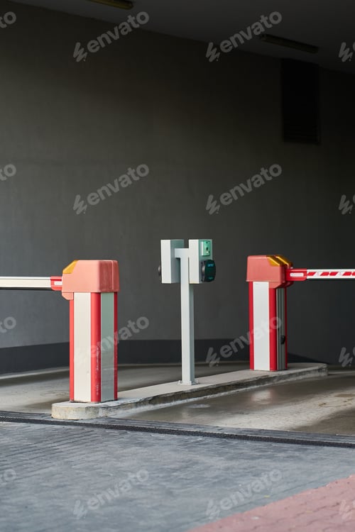 Preview: White and red gate arm at modern parking area
