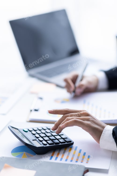 Preview: Asian female accountant or banker making calculations. Young business asian woman in workplace,