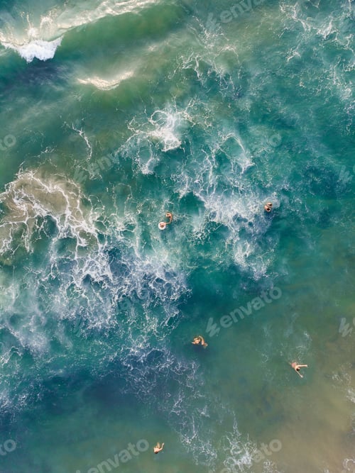 Preview: Top view shot of people swimming in Varkala Beach