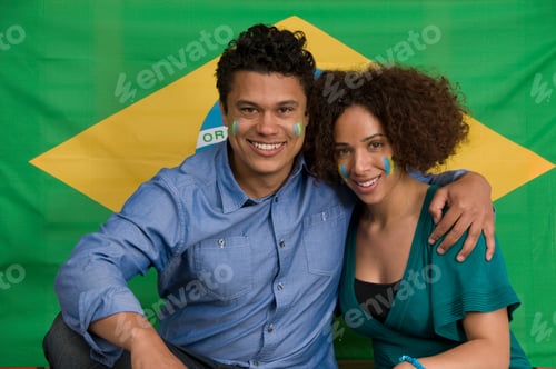 Preview: Couple smiling with Brazilian flag