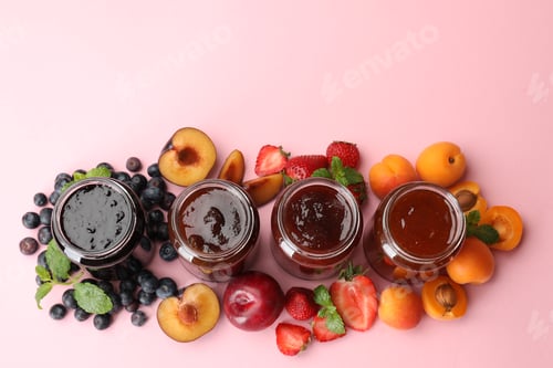 Preview: Different jams in jars and ingredients on light pink background, flat lay. Space for text