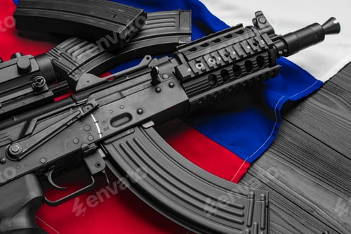 Preview: Rifle weapon on flag of Russia close up
