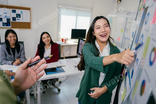 Preview: Asian businesswomen sharing ideas during corporate meeting