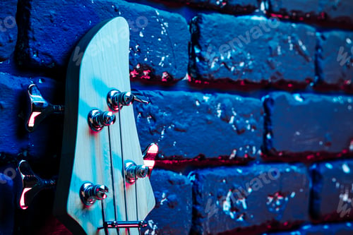 Preview: Guitar headstock with tuners on dark background