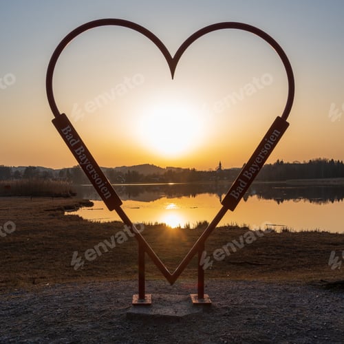 Preview: Beautiful metal heart at sunset with the name of Bad Bayersoien Municipality in Germany