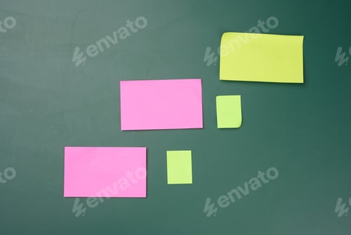 Preview: Multicolored paper sticks are glued to the green board