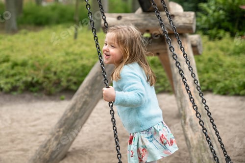 Preview: A Girl riding on a swing