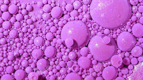 Preview: Top view abstract of pink bubbles in paint. Inks, spheres, oil. Colorful shapes.