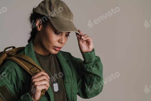 Preview: Confident african american soldier woman posing with backpack