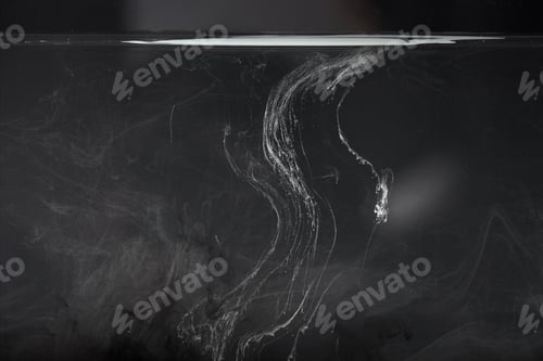 Preview: abstract black background with white paint swirls
