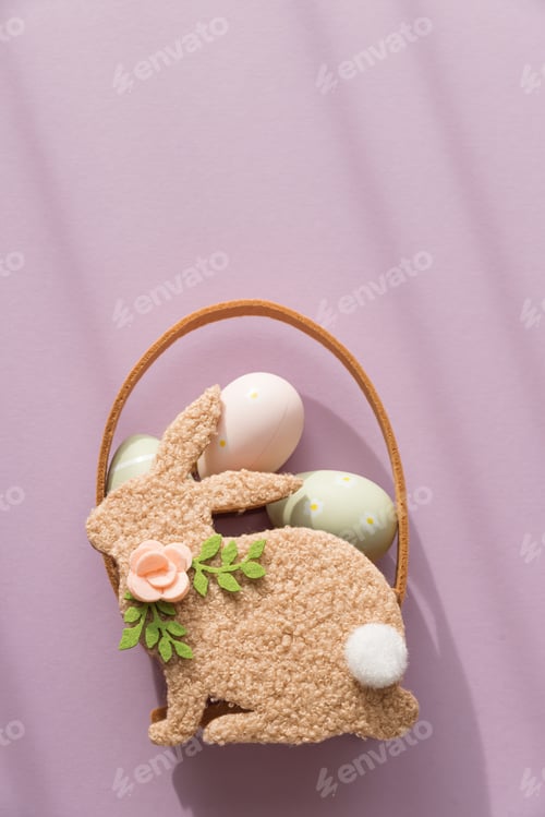 Preview: Pastel Easter Bunny Basket with Eggs and Flowers on Lavender Background
