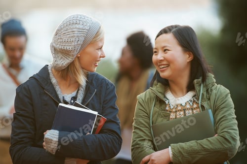 Preview: College life. Shot of a college students between classes on the campus grounds.