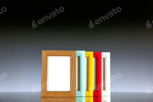 Preview: front view different picture frames with colored corners on light dark background picture family