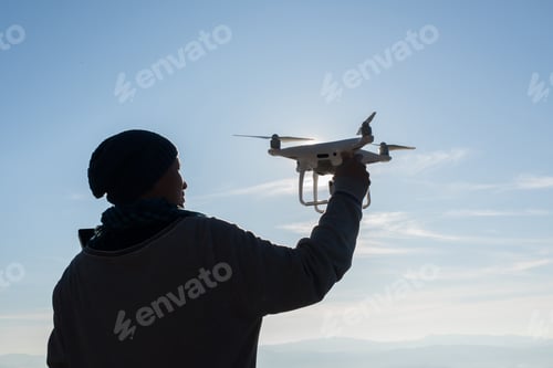 Preview: Men's hands hold the drone, pick it up