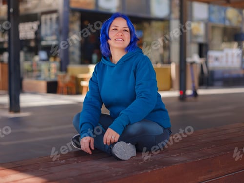 Preview: blue hair woman listening music