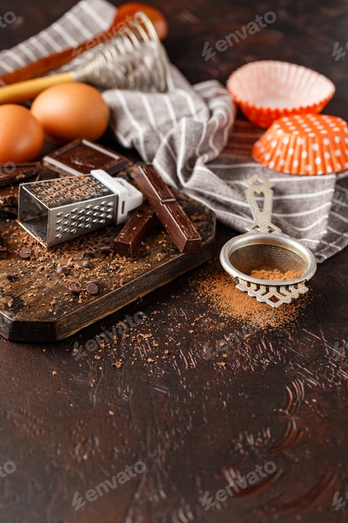 Preview: Chocolate, Eggs, and Baking Utensils on Wooden Board