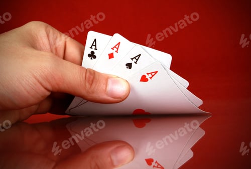 Preview: Person playing cards with four of a kind in the hand