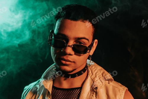 Preview: Freaky Clubber Man In Sunglasses Smiling, Stylish Guy Portrait In Neon Light