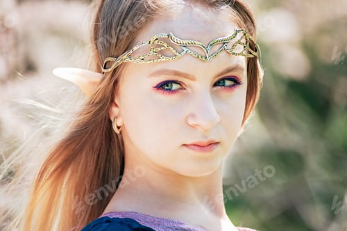 Preview: fairy tale girl. Portrait of mystic elf girl. Cosplay character. Portrait of elf in a blooming