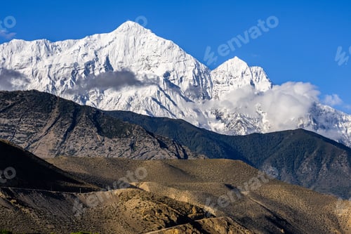 Preview: White snowy Nilgiri Mountain Peak seen from Kagbeni Village in Upper Mustang, Nepal