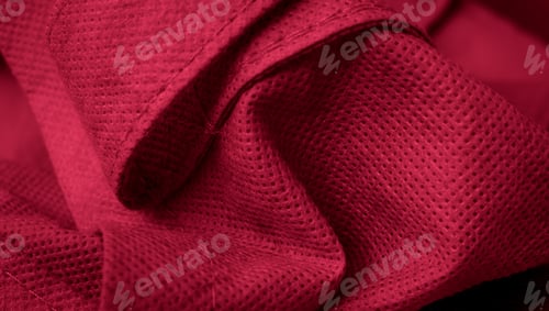 Preview: red cotton fabric with visible details. background or textura