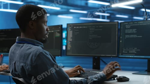Preview: IT specialist in server farm ensuring valuable data remains shielded