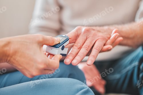 Preview: Shot of a nurse checking the blood pressure of a mature patient