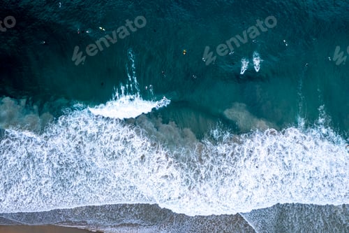 Preview: Aerial view of surfers riding the waves in Newport Beach, California
