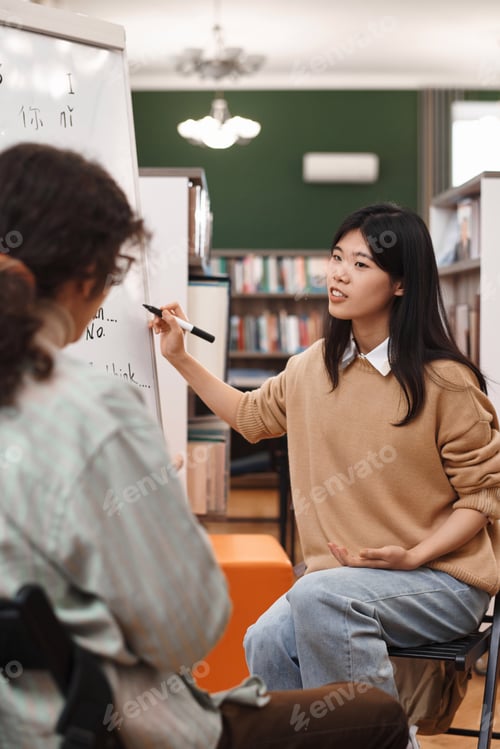 Preview: Young Asian Woman Explaining Grammar Rules