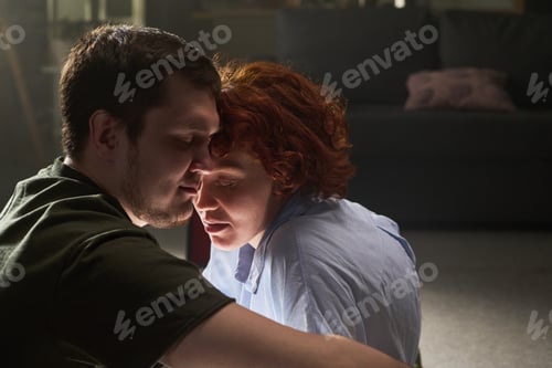 Preview: Young Man Comforting Young Woman during Emotional Moment