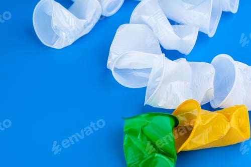 Preview: Disposable colored plastic cups garbage. Garbage and pollution concept