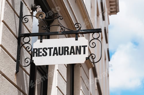 Preview: Vintage Metal Restaurant Sign Hanging On City Wall