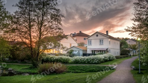 Preview: Sunset lights the houses in Molndal, suburb Gothenburg city, Swe