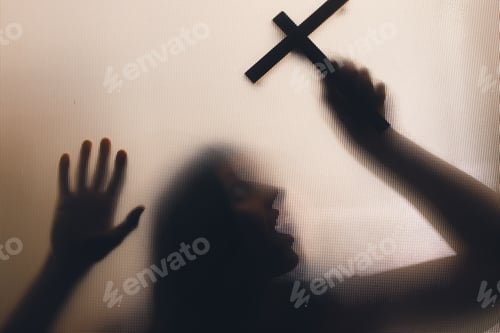 Preview: Shadowy figure with cross behind glass - horror background