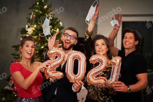 Preview: Two beautiful young couples having fun at New Year's Eve Party