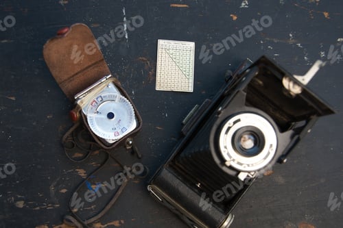Preview: retro camera on the black background with slides