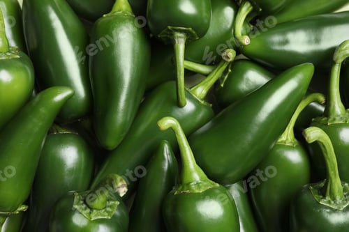 Preview: Ripe green chili peppers as background, closeup