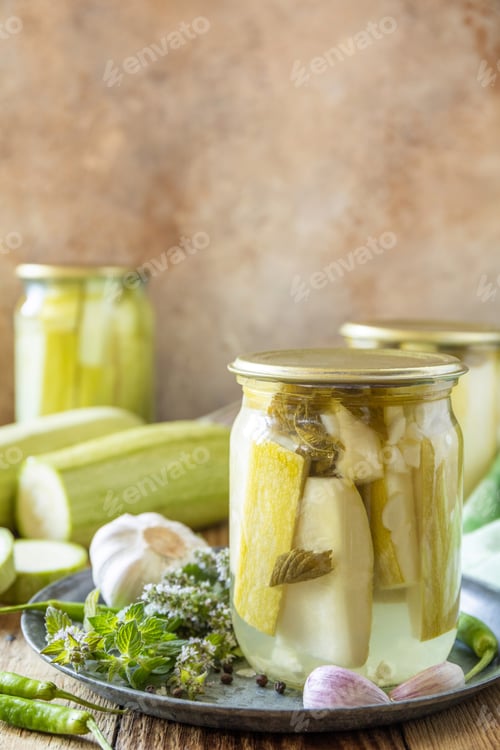 Preview: Salted pickled cucumbers with mustard preserved canned in glass jar.