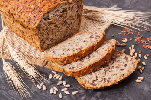 Preview: Wholegrain bread with ingredients for baking and ears of rye or wheat grain