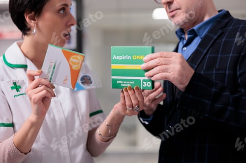 Preview: Pharmacy assistant recommending vitamin and aspirin to client