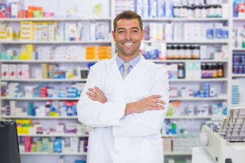 Preview: Handsome Pharmacist Smiling At Camera At The Hospital Pharmacy