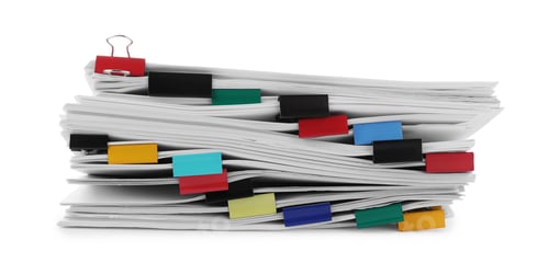 Preview: Stack of documents with binder clips isolated on white